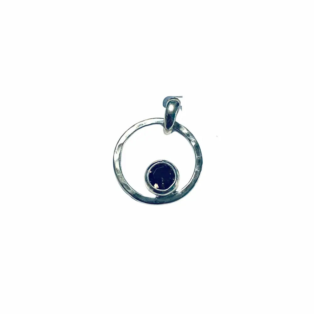 A silver round pendant featuring a smoky quartz crystal in the center, with a loop at the top for a chain.